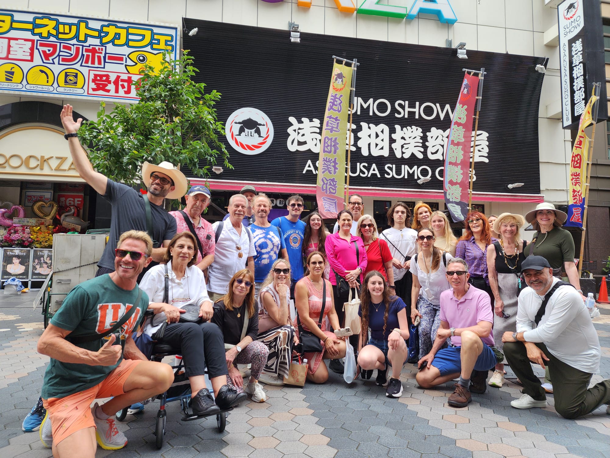Group relaxing at a Japanese garden pavilion